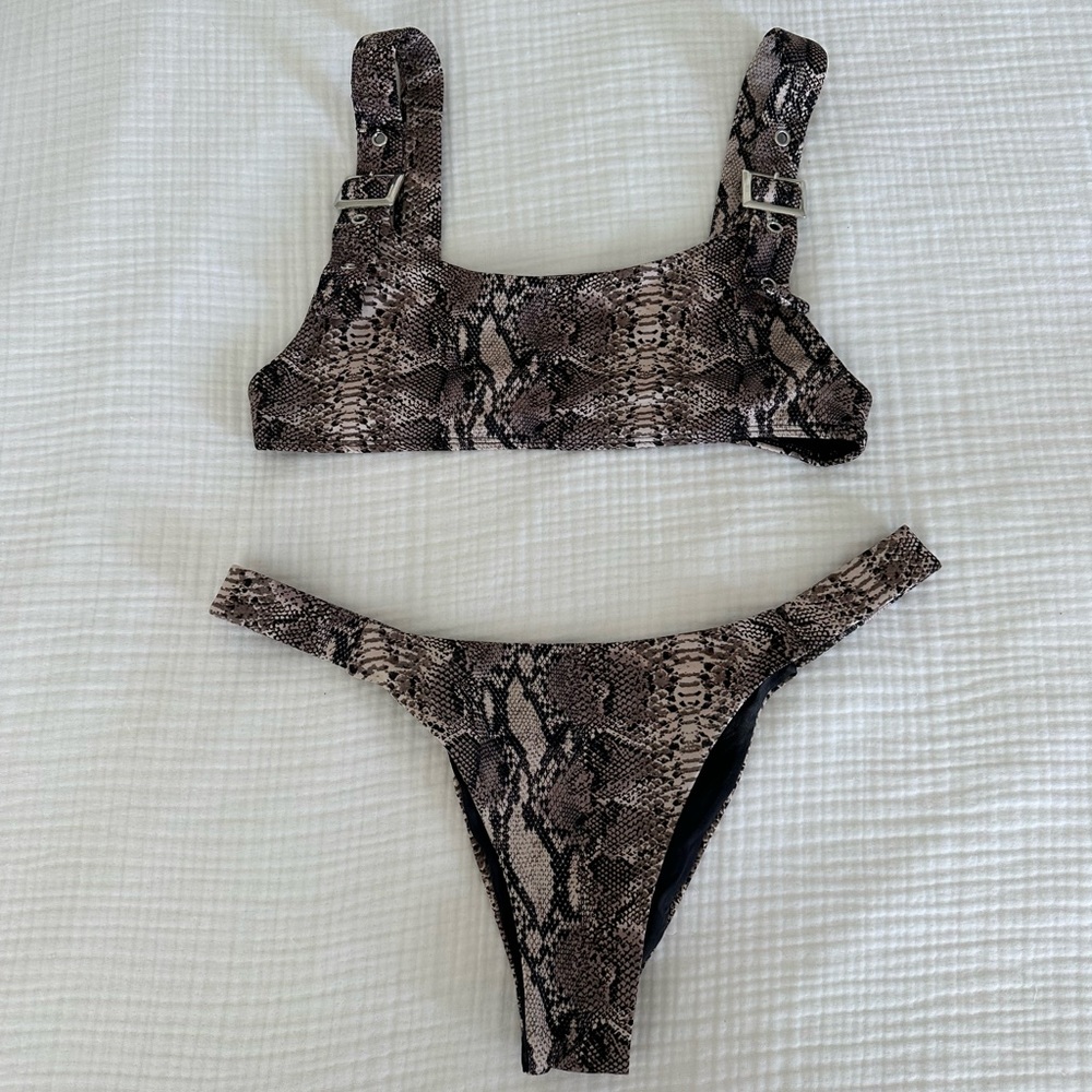 Frankie’s Bikinis two piece bikini snakeskin with silver hardware.
